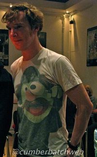 Benedict Cumberbatch wearing a shirt screen printed with Sherlock Hemlock, one of the Sesame Street Muppets. Epic.