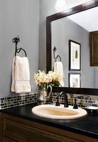 A small band of glass tile is a pretty AND cost-effective backsplash for a bathroom.