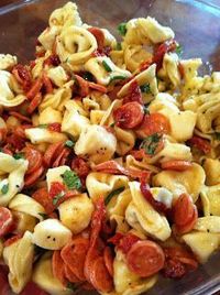 Tortellini Salad - cheesy tortellini, cubes of soft mozzerella, chopped pepperoni and cherry tomatoes. Tossed in basil Ceasar dressing.